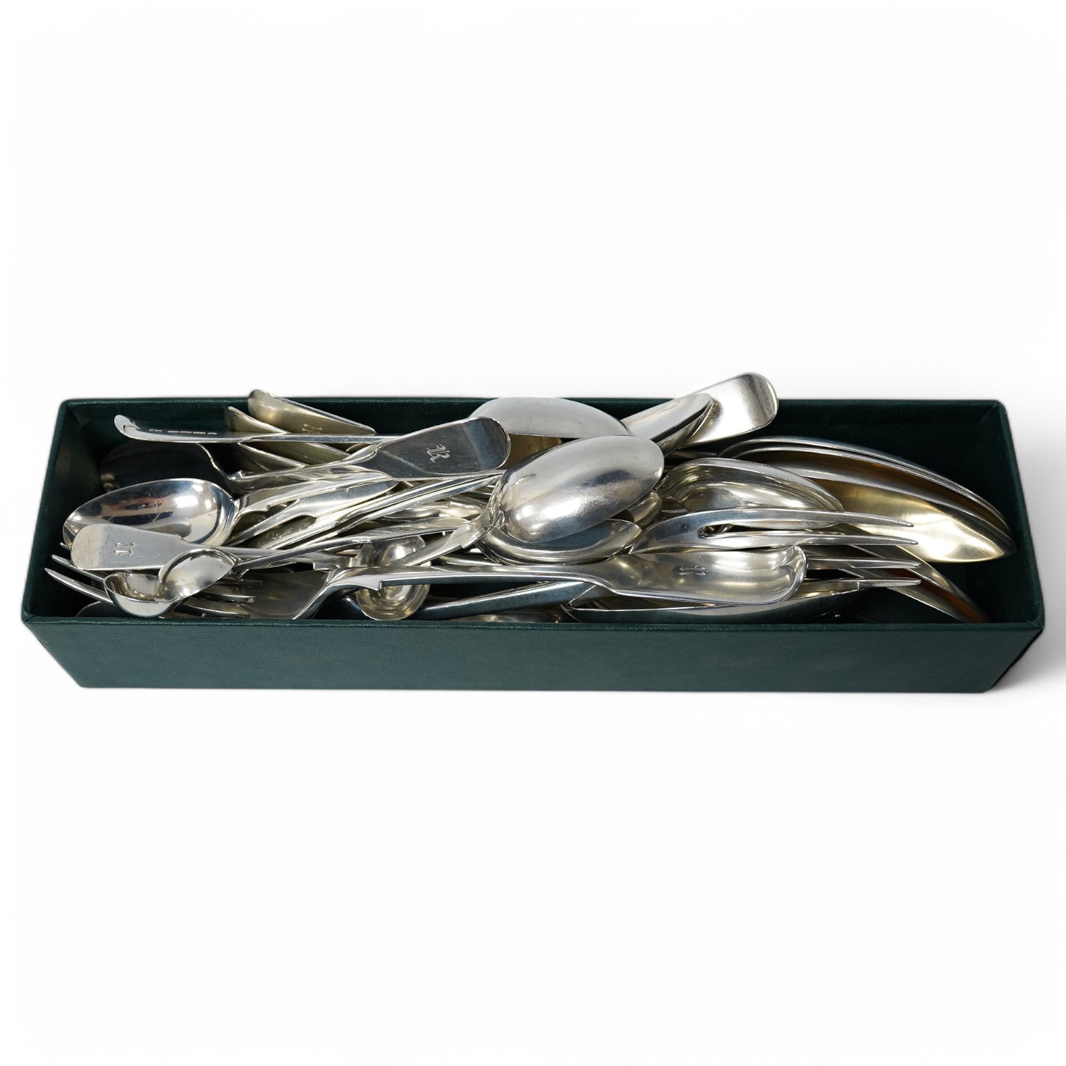 A part canteen of Victorian provincial silver fiddle pattern flatware by Josiah Williams & Co, Exeter, 1881, comprising six table forks, six tablespoons and eleven teaspoons, all with engraved initial, together with four